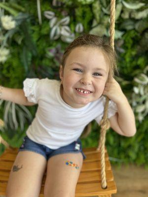 My beautiful granddaughter! The swings are such a cool addition to the whole experience!