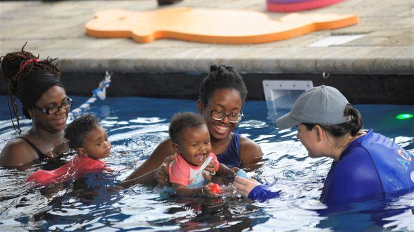 Getting comfortable in the water! We start swim lessons at 2 months old! 2-6 Month old FREE swim lessons!