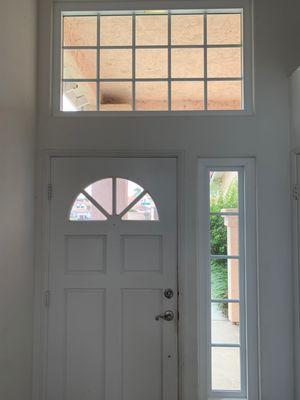 Large replacement window about the door that rattles when the door closes