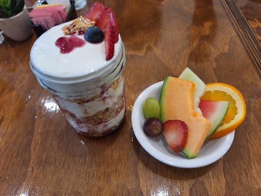 Yogurt parfait with a side of fresh fruit