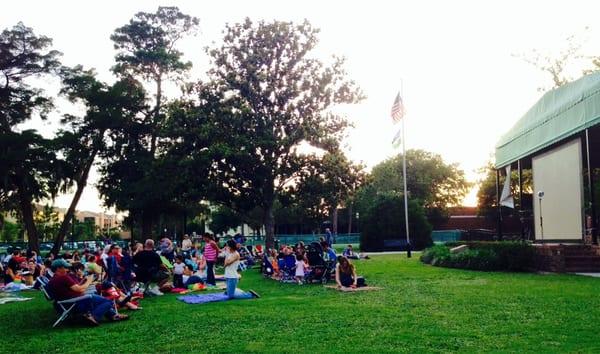 Movies in the Park, with picnickers waiting to see Mary Poppins.