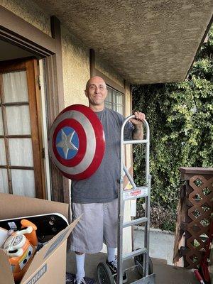 This is Charlie...holding my grandsons Captain America shield!!  They truly are "Super Hero" Movers!!