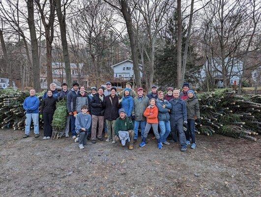 Follen Church volunteers unloading trees in 2023.