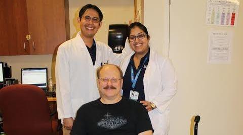 Archie and Anne with George (center) at a Physical Therapy Session at Anaheim Terrace Care Center.