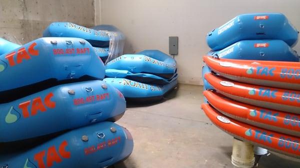 Logos applied to commercial outfitter rafts.