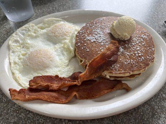 My delicious bacon and egg combo with very crispy bacon and two pancakes. It's on the senior special list for $11.50.