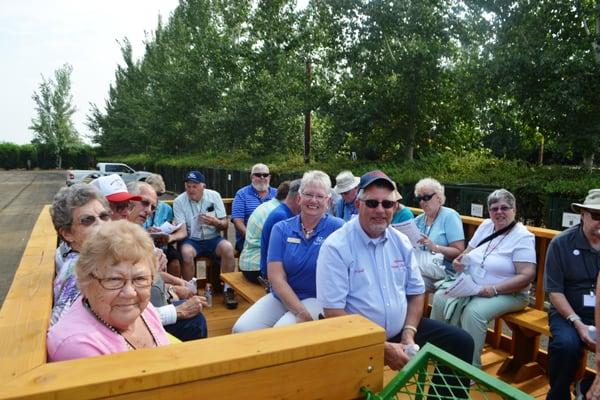 A recent tour group taking a ride on our tractor 'hayride'