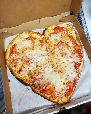 Heart shaped pizza that looks way bigger than a small. Crust was thin and crispy