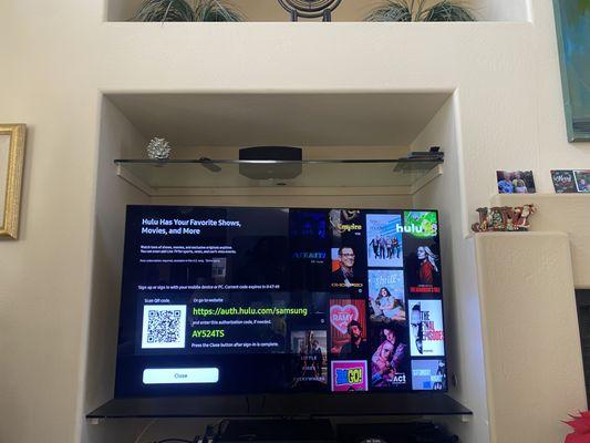 Cubby hole TV mounting with long extension articulating mount