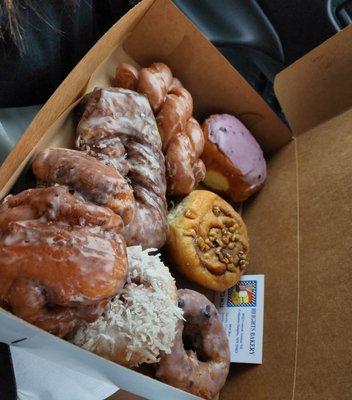 Coconut donut, pecan roll, blueberry filled donut, coffee turnover, I forgot the names of the big ones