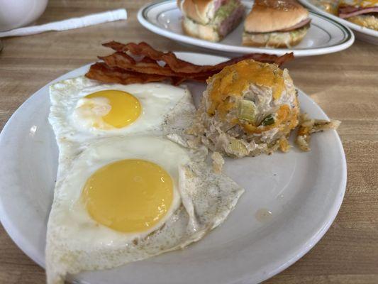 2egg breakfast with bacon, hashbrowns! Ham sandwich in the background