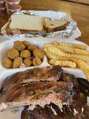 Ribs, fried okra, French fries and pound cake.