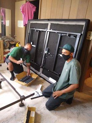 Howard and Brian setting up the adjustable bed frame