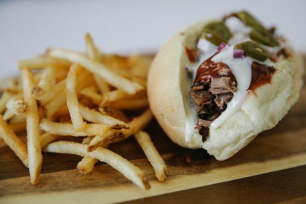 BBQ Philly - Chopped brisket, our white cheddar cheese, our homemade original sauce with onions and jalapenos.