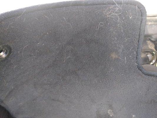 Driver side floor mat. Lots of hair left. I shook out the dirt before I snapped it. This is after they "cleaned".