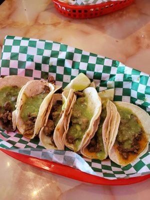 Carne asada tacos with guacamole salsa.