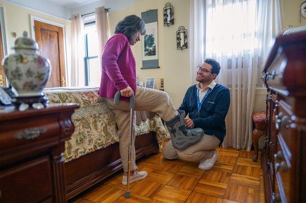 One of our team members helping adjust a patient's boot.