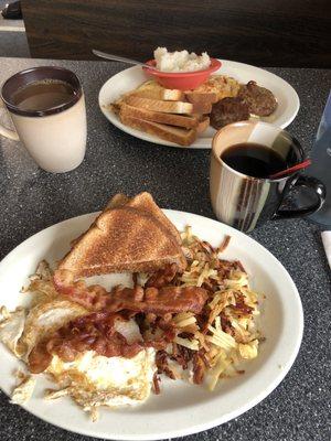 Western omelette with sausage, patties, and grits. Two eggs over easy with hashbrowns and bacon.