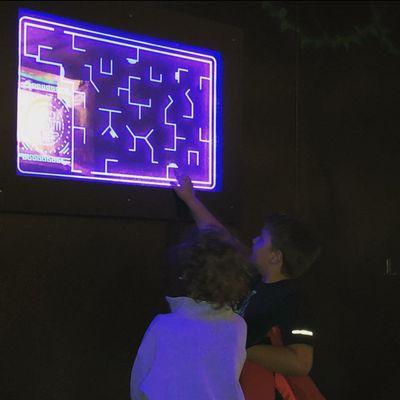 Two young boys plan their strategy at the laser tag map at Funtrackers Family Fun Park in Hot Springs, AR