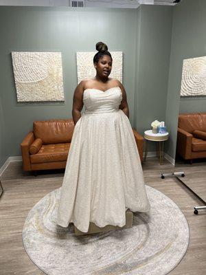 After securing you in your dress, you walk out into your private room to show your guests and check out the 360 view of the gown.