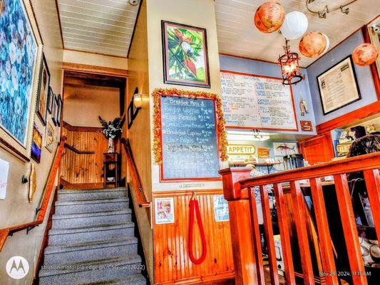 As you enter Paul's Place. To the right is the dining room with only three tables. Both menus in the distance. (Brunch 11/29/24)