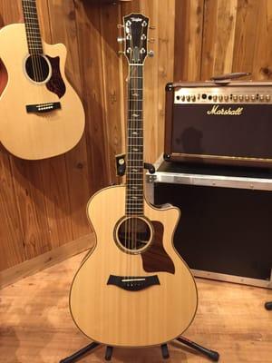 A grand guitar!  The Taylor 814ce!  A favorite of mine to pull off the wall whenever I visit the acoustic room at this location!