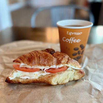 Colombian Coffee & Croissant Sandwich: eggs, tomatoes, provolone cheese.