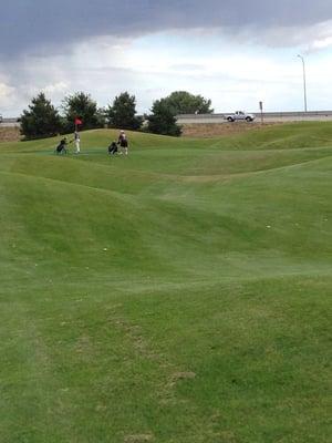 First tee - left rough 100 yards out - 4 iron tee shot.