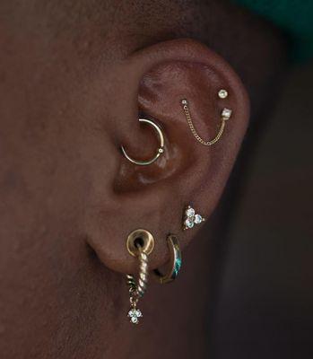 Daith Piercing by Carly
Flat to Helix Piercing by Priscilla with Yellow Gold and Diamonds from designer, Pupil Hall