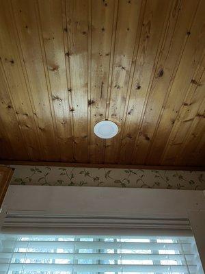 Recessed light trim in wood ceiling