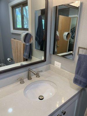 View of corner of bathroom with second sink with new fixtures.  Main mirror is 96" x 36" and goes across entire counter.