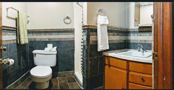 Bathroom, stand up shower, beautiful tile work from this remodel.