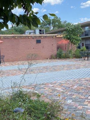 More of the court yard taken by the BBQ that don't work more weeds