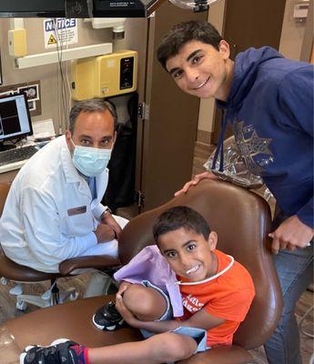 Dr. G and an unusually happy child after molar extraction