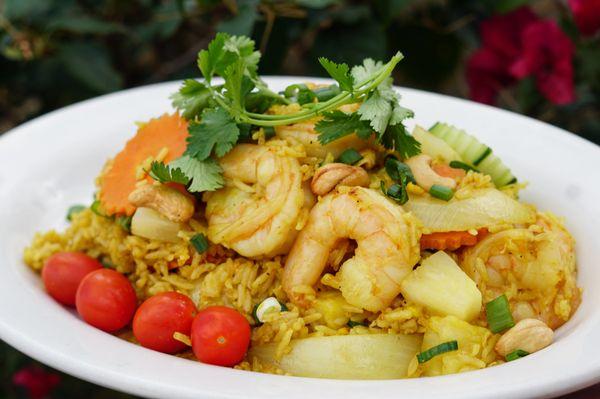 Pineapple Fried Rice - Stir fried rice with egg, pineapple, cashew nuts, onion, carrots, curry powder