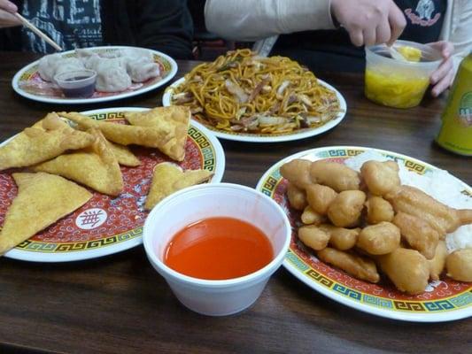 (Clockwise from top left) Dumplings, Lo Mein, Wonton Soup, Sweet and Sour Chicken, Crab Ragoon