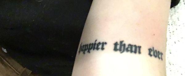 $300 small script tattoo