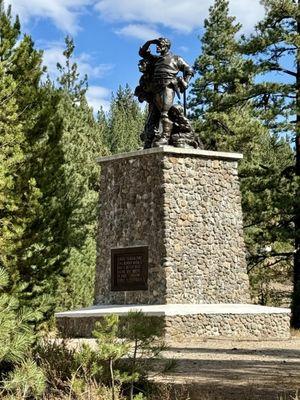 10.06.24 The pedestal is shadowed by spruce trees on either side of the monument