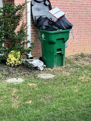 Trash is overflowing onto the ground. Attract rodents, insects and birds.