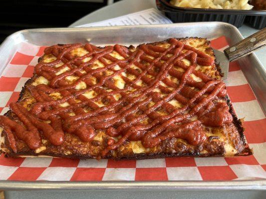 Four-slice pizza, plain. Note: sauce atop the cheese.