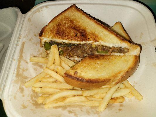 Philly Steak & Cheese SuperMelt Sandwich with fries.