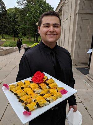 Serving up savory spanikopita at Heckscher Museum of art.