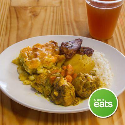 Curry Chicken Platter Served With Sweet Plantain, Rice, and Mac&Cheese