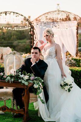 Bride, groom, florals, venue, sweetheart table, custom draping