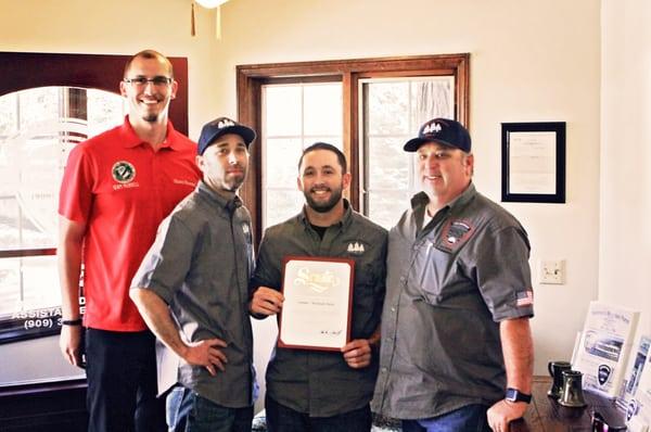 Ron Hammer & sons Ronnie & Nick receiving a certificate of recognition from our local senator's office.