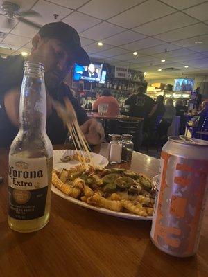 Loaded cheese fries with local 603 and non local Corona! Perfect pairing. Lol