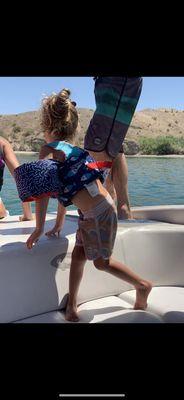 Kai getting ready to watch for the first time his Mommy wakeboard