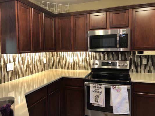 We just completed this beautiful backsplash! I love the sparkle. It brings out the stainless steel appliances beautifully!