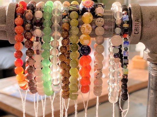 Handmade Mala necklaces and crystal healing bracelets by local artisans.