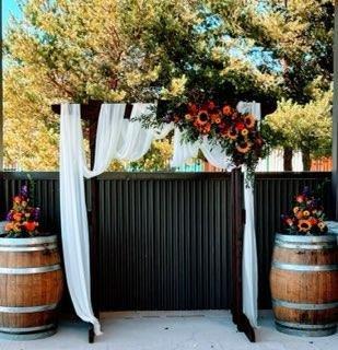 Our beautiful arbor and wine barrels, look at those gorgeous flowers!!